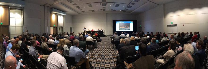 A full room of people listen to a FirstNet panel at an APCO conference