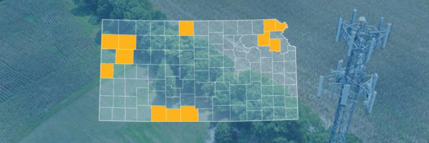 The state of Kansas, with outlined county borders; a cell tower.