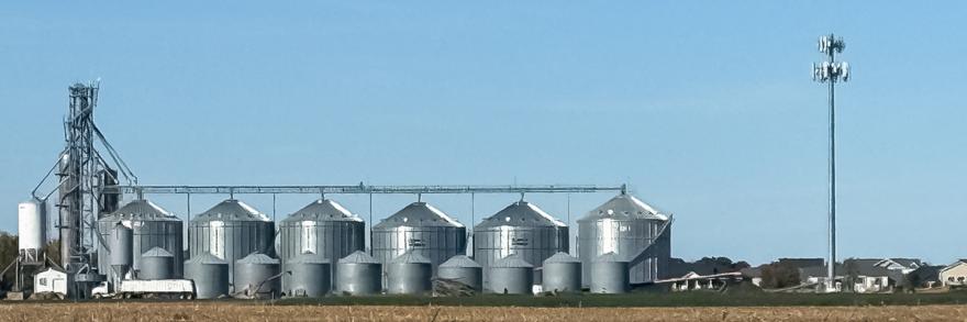 Farm buildings and a FirstNet cell tower in a rural area of North Dakota 