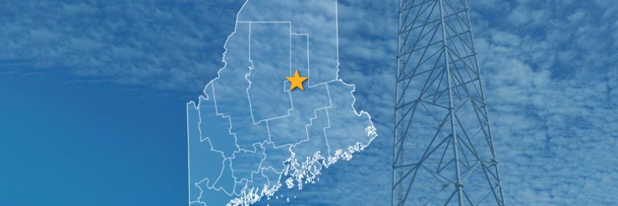 The State of Maine, with outlined county borders and star locating Millinocket, Maine; a cell tower.