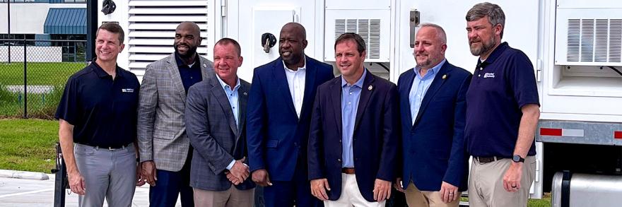South Carolina public safety leaders, FirstNet Authority and AT&T staff, and U.S. Representative Russell Fry stand in front of a FirstNet SatCOLT