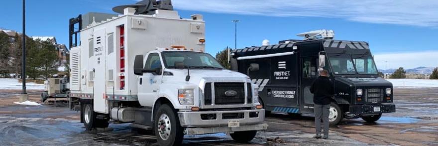 A FirstNet Satellite Cell on Light Truck and Communications Vehicle sit in a parking lot during the response to the Marshall Fire in Boulder County, Colorado 