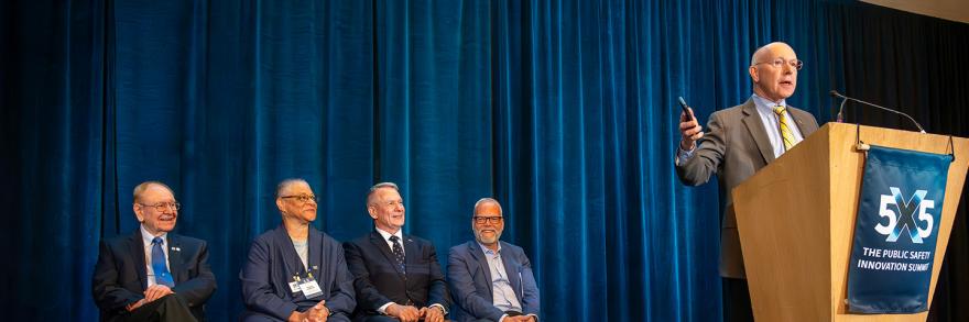 Bill Schrier speaks on stage after receiving the McEwen Award 