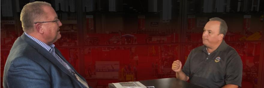 FirstNet Authority Senior Public Safety Advisor Gary McCarraher sits at table across from Chief Charles Doody of the Canton Fire Department in Massachusetts.