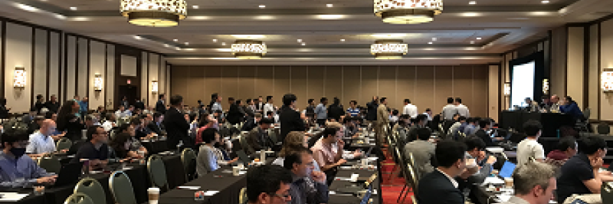 Hundreds of people sit in a room during a presentation at the 3GPP plenary meetings June 11-15, 2018 in La Jolla, CA