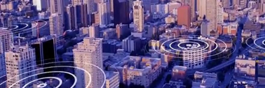 A graphic representation of signals spreading out across a major city with skyscrapers and many buildings