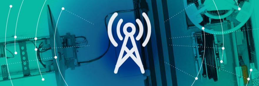 Roadmap Coverage and Capacity Domain icon (a broadband tower), surrounded by a graphic representation of a network radiating out, over an aerial view of a FirstNet SatCOLT 