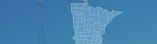 State of Minnesota with counties outlined; a star locating Angle Inlet, a cell tower