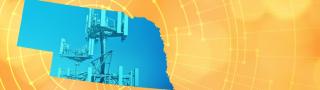 The silhouette of the State of Nebraska revealing a cell tower inside; radiating connectivity illustration