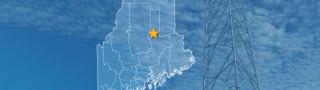 The State of Maine, with outlined county borders and star locating Millinocket, Maine; a cell tower.
