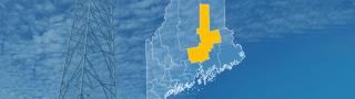 The state of Maine, with outlined county borders; a cell tower.