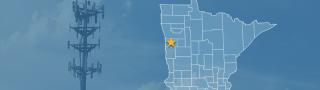 State of Minnesota with counties outlined; a star marking Norman County; a cell tower 