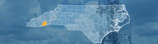 The state of North Carolina, with outlined county borders; a cell tower