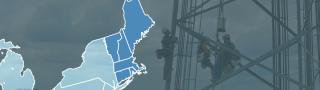Map of New England with Maine, New Hampshire, Vermont, Massachusetts, Connecticut, and Rhode Island highlighted; workers on a cell tower above the treetops.