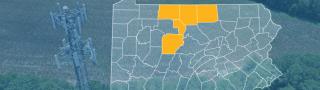 The state of Pennsylvania, with outlined county borders; a cell tower.