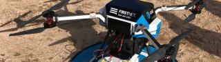 A flying COW with the AT&T FirstNet logo sits on the ground ready to launch