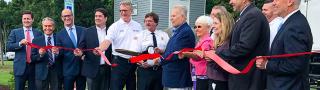 Maryland Delegate Johnny Mautz, FirstNet Authority Board Member David Zolet and others cut a red ribbon to celebrate a new cell site in Tilghman Island