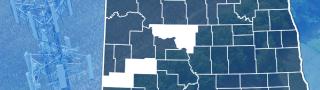 County map of North Dakota with Slope, McClean and Stark counties highlighted, FirstNet tower near a field