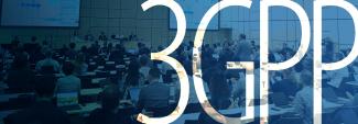 Panel discussion at the June 2025 3GPP meeting with participants seated at conference tables; two large projection screens behind the panel show presentation slides; “3GPP”