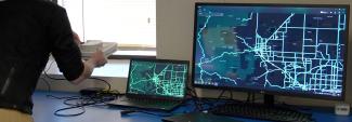 A man setting up an Emergency Operations Center in a new space.