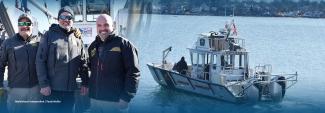 On the left, Assistant Harbormaster Jarret Russo, Deputy Harbormaster Craig Smith, and Harbormaster Mark Souza stand at the bow of the Stacey H. Clark while on the right, the same boat sails off the coast of Massachusetts on its maiden voyage. 
