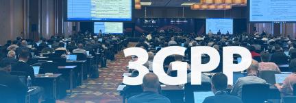 Attendees at the June 2026 3rd Generation Partnership Project plenary meeting sit in a conference room; large presentation screens show data