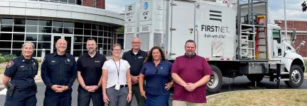 Winnebago County Sheriff’s Office, FirstNet Authority and FirstNet Built with AT&amp;T and AT&amp;T personnel in front of a SatCOLT outside.