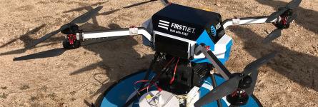 A flying COW with the AT&amp;T FirstNet logo sits on the ground ready to launch