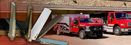 High Power User Equipment; Two Shawnee County Fire District #4 response vehicles parked in front of the firehouse.